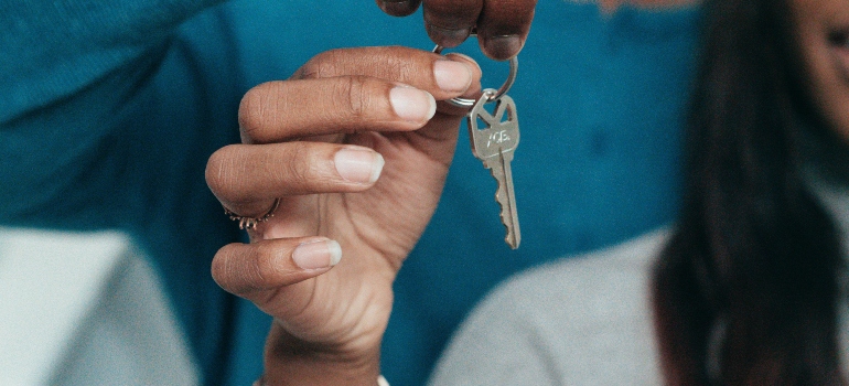 a girl holding the key
