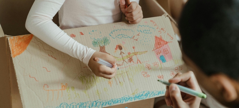 two children drawing a picture