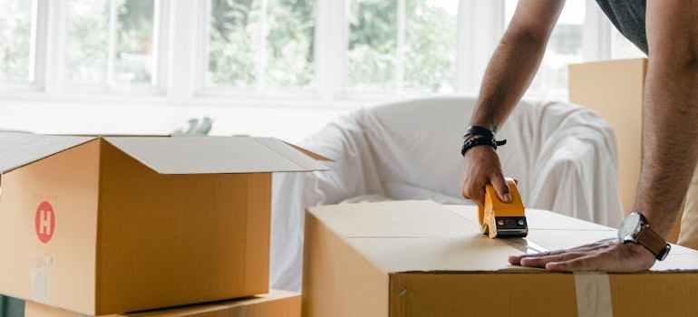 packed moving boxes ready for broker-coordinated pickup
