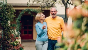 Smiling couple looking relaxed and happy, feeling worry-free because they have moving insurance coverage.